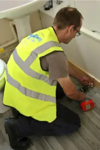 ASW Property Services worker in Carmarthenshire County Council property delivering maintenance